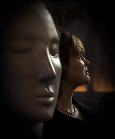 Sculptor Emily Young with one of her "Angel Heads"